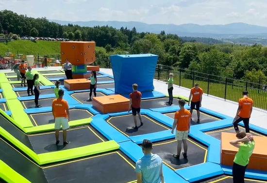 How can team building in a Trampoline park improve relationships within a company? - Akrobat